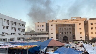 Smoke rises as displaced Palestinians take shelter at Al Shifa hospital, amid the ongoing conflict between Hamas and Israel, in Gaza City on November 8. (Reuters)