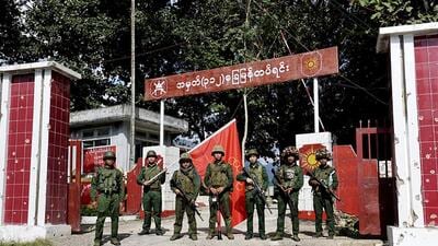 Members of the Myanmar National Democratic Alliance Army pose for a photograph in front of the seized army's infantry battalion in Kunlong township in Shan state, Myanmar on Nov. 12. (AP) Members of the Myanmar National Democratic Alliance Army pose for a photograph in front of the seized army's infantry battalion in Kunlong township in Shan state, Myanmar on Nov. 12. (AP)