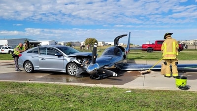 This photo provided by the McKinney Fire Department shows officials at the site of a crash involving a small plane and a vehicle near Aero Country Airport, Saturday, Nov. 11, 2023, in McKinney, Texas. Authorities say a small plane overshot the runway while trying to land at a Texas airport and struck a car that was driving along a nearby road, injuring one person. (McKinney Fire Department via AP) (AP) This photo provided by the McKinney Fire Department shows officials at the site of a crash involving a small plane and a vehicle near Aero Country Airport, Saturday, Nov. 11, 2023, in McKinney, Texas. Authorities say a small plane overshot the runway while trying to land at a Texas airport and struck a car that was driving along a nearby road, injuring one person. (McKinney Fire Department via AP) (AP)