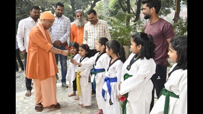 The Uttar Pradesh CM with children taking taekwondo training at Gorakhnath temple in Gorakhpur on Nov 14. (HT photo) The Uttar Pradesh CM with children taking taekwondo training at Gorakhnath temple in Gorakhpur on Nov 14. (HT photo)