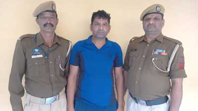 The accused in police custody. (HT Photo)