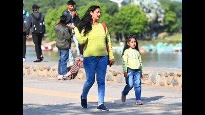 Visitors enjoying the clear weather at Sukhna Lake in Chandigarh on Tuesday. (Keshav Singh/HT)