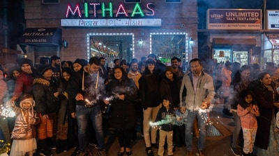 JERSEY CITY, NEW JERSEY - NOVEMBER 12: People hold sparklers as they celebrate Diwali on November 12, 2023 in Jersey City, New Jersey. Diwali (Getty Images via AFP) JERSEY CITY, NEW JERSEY - NOVEMBER 12: People hold sparklers as they celebrate Diwali on November 12, 2023 in Jersey City, New Jersey. Diwali (Getty Images via AFP)