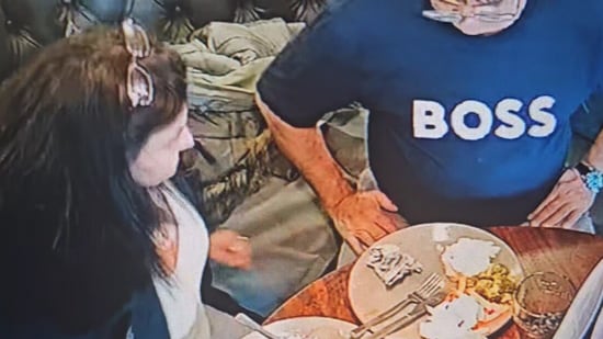 Snapshot of the woman adding hair to food. (Facebook/@TheObservatory)