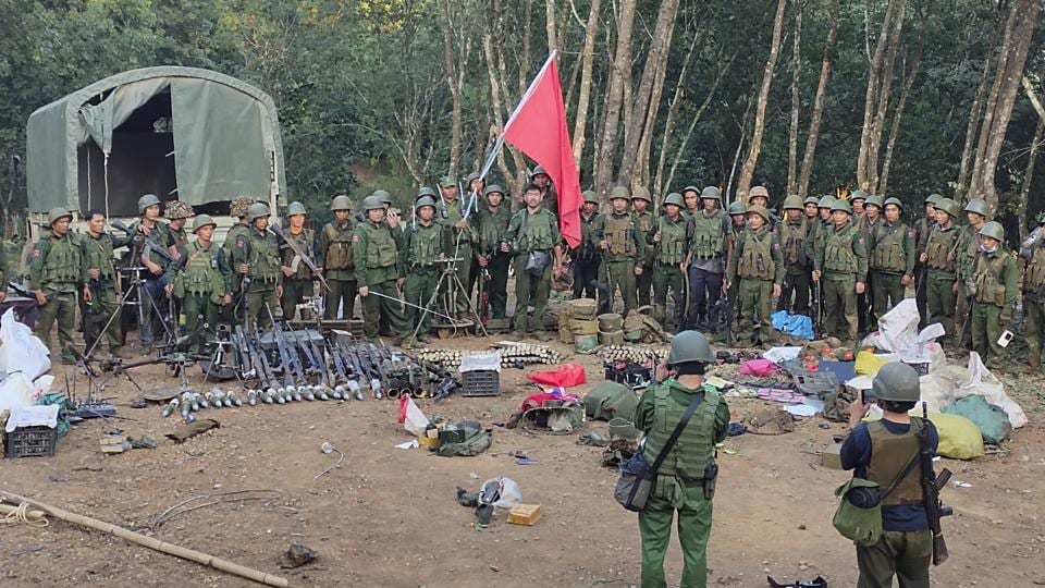 Members of the Myanmar National Democratic Alliance Army pose for a photograph with the weapons allegedly seized from the Myanmar’s army outpost on a hill in Chinshwehaw town, Myanmar, on Oct. 28, 2023 (The Kokang” online media via AP) Members of the Myanmar National Democratic Alliance Army pose for a photograph with the weapons allegedly seized from the Myanmar’s army outpost on a hill in Chinshwehaw town, Myanmar, on Oct. 28, 2023 (The Kokang” online media via AP)