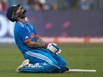 Virat Kohli celebrates his century during the ICC Men's Cricket World Cup first semi-final match between India and New Zealand