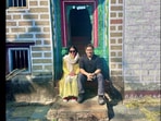 MS Dhoni and Sakshi Singh posing outside a house. MS Dhoni and Sakshi Singh posing outside a house.