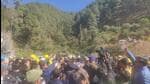 The protestors raised slogans against the authorities in front of the collpased under-construction tunnel in which 40 labourers have been trapped since Sunday morning. (HT Photo)