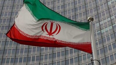 An Iranian flag flutters.