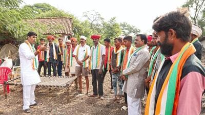 A Congress candidate reaches out to tribal voters in Jhabua assembly constituency. (PTI) A Congress candidate reaches out to tribal voters in Jhabua assembly constituency. (PTI)