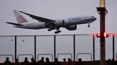 A China Airlines cargo plane flies past as fans sit in the stands during the NFL game between Miami Dolphins and Kansas City Chiefs at the Waldstadion in Frankfurt am Main, western Germany on November 5, 2023. (AFP) A China Airlines cargo plane flies past as fans sit in the stands during the NFL game between Miami Dolphins and Kansas City Chiefs at the Waldstadion in Frankfurt am Main, western Germany on November 5, 2023. (AFP)