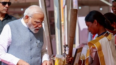 PM Modi inspects an exhibition after paying tribute to freedom fighter Birsa Munda on his birth anniversary in Khunti district. (ANI) PM Modi inspects an exhibition after paying tribute to freedom fighter Birsa Munda on his birth anniversary in Khunti district. (ANI)