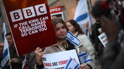 Protesters holding placards and Israeli flags join a gathering outside the headquarters of the BBC (British Broadcasting Corporation) in London on October 16, 2023, to appeal to the corporation to call Hamas 'terrorists'. (Photo by Daniel LEAL / AFP) (AFP) Protesters holding placards and Israeli flags join a gathering outside the headquarters of the BBC (British Broadcasting Corporation) in London on October 16, 2023, to appeal to the corporation to call Hamas 'terrorists'. (Photo by Daniel LEAL / AFP) (AFP)