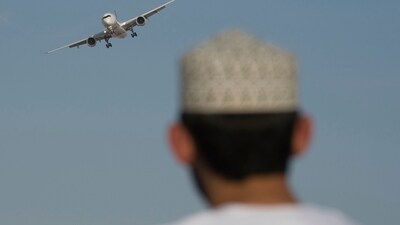 A man watches an Airbus A350 at the Dubai Air Show in Dubai, United Arab Emirates. (AP) A man watches an Airbus A350 at the Dubai Air Show in Dubai, United Arab Emirates. (AP)