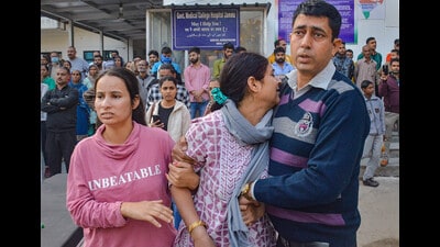 Family members of an injured outside Government Medical College and Hospital, Jammu on Wednesday. (PTI) Family members of an injured outside Government Medical College and Hospital, Jammu on Wednesday. (PTI)