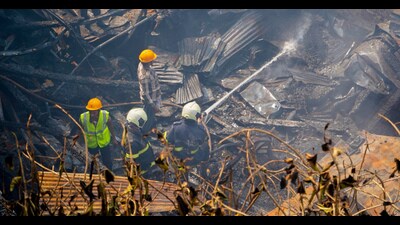 Firefighters douse the fire that broke out at a Garment shop, at Saifi compound, Sakhali Street Byculla, on Wednesday. (Bhushan Koyande/HT Photo) Firefighters douse the fire that broke out at a Garment shop, at Saifi compound, Sakhali Street Byculla, on Wednesday. (Bhushan Koyande/HT Photo)