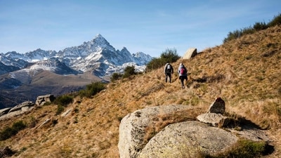Hikers walk near the Monviso mountain near the village of Ostana, Alps Region, Northwestern Italy. Is the golden era of European mountaineering coming to an end? Here's what tourists should know (Photo by MARCO BERTORELLO / AFP) Hikers walk near the Monviso mountain near the village of Ostana, Alps Region, Northwestern Italy. Is the golden era of European mountaineering coming to an end? Here's what tourists should know (Photo by MARCO BERTORELLO / AFP)