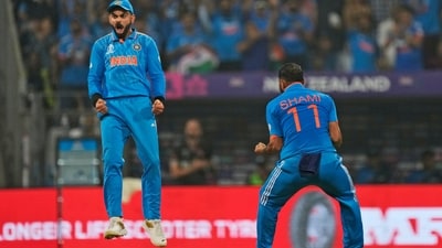 Virat Kohli with his fellow cricketer Shami at the ICC Men's Cricket World Cup first semifinal match between India and New Zealand (AP) Virat Kohli with his fellow cricketer Shami at the ICC Men's Cricket World Cup first semifinal match between India and New Zealand (AP)
