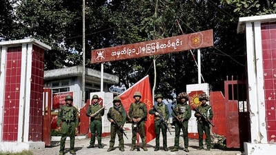 Members of the Myanmar National Democratic Alliance Army pose for a photograph in front of the seized army's infantry battalion in Kunlong township in Shan state, Myanmar on Nov. 12. (AP) Members of the Myanmar National Democratic Alliance Army pose for a photograph in front of the seized army's infantry battalion in Kunlong township in Shan state, Myanmar on Nov. 12. (AP)