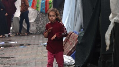 Israel-Hamas War: An internally displaced Palestinian girl living in a shelter set up in a school run by the UN agency for Palestinian refugees (UNRWA). (AFP)