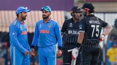 New Zealand batters Daryl Mitchell and Rachin Ravindra, India's Rohit Sharma and Virat Kohli during World Cup 2023 match between India and New Zealand (PTI)