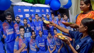 Visually impaired girls put 'tilak' on the photograph of Indian cricketers as they celebrate Bhai Dooj in Kolkata. (PTI) Visually impaired girls put 'tilak' on the photograph of Indian cricketers as they celebrate Bhai Dooj in Kolkata. (PTI)