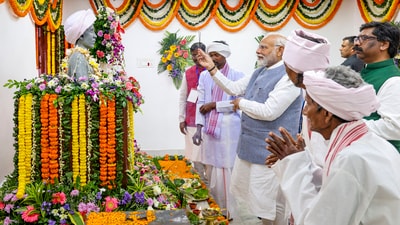 PM Modi, the first prime minister to visit Ulihatu, was accorded a warm welcome with locals dancing to the tunes of traditional instruments such as dhol and mandar. (PTI) PM Modi, the first prime minister to visit Ulihatu, was accorded a warm welcome with locals dancing to the tunes of traditional instruments such as dhol and mandar. (PTI)