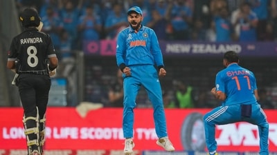 Mohammed Shami celebrates with Virat Kohli after taking the wicket of New Zealand's Rachin Ravindra (PTI) Mohammed Shami celebrates with Virat Kohli after taking the wicket of New Zealand's Rachin Ravindra (PTI)