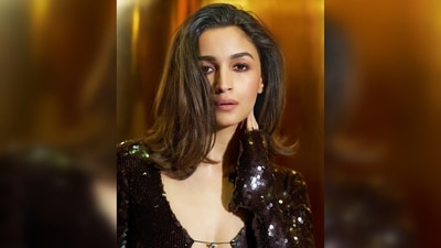 Alia Bhatt elevated the glamour factor by donning a long, shimmery brown dress with a cut-out and a leg slit. (Instagram/@aliaabhatt) Alia Bhatt elevated the glamour factor by donning a long, shimmery brown dress with a cut-out and a leg slit. (Instagram/@aliaabhatt)