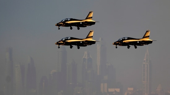 The city skyline in background, as Al Fursan", or the Knights, a UAE Air Force aerobatic display team, prepare for landing during second day of the Dubai Air Show, United Arab Emirates, Tuesday.(AP)