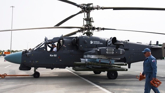 A Russian KA-52 helicopter is pulled into position at the Dubai Air Show in Dubai, United Arab Emirates, Wednesday.(AP)