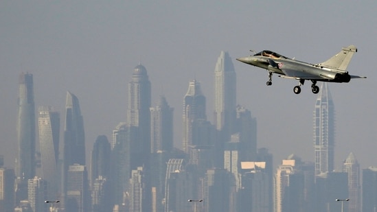 The skyline of the city is seen on the background as a French Air Force Dassault Rafale C jet fighter prepares to land during the opening day of the Dubai Air Show, Monday.(AP)