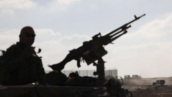 Israeli soldiers make their way towards Israel's border with Gaza, amid the ongoing ground invasion against Palestinian Islamist group Hamas, in southern Israel, November 8, 2023.