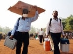Polling officials carrying the election materials for their election duty on the eve of the Madhya Pradesh Assembly elections Polling officials carrying the election materials for their election duty on the eve of the Madhya Pradesh Assembly elections