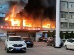 Fire burns at the Yongju Coal Industry Joint Building, in Luliang City, Shanxi province, China. (Reuters)