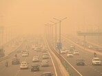Vehicles ply amid low visibility due to dense smog on the Delhi-Meerut expressway, in New Delhi on Thursday.