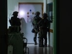 This handout picture released by the Israeli army on November 15, 2023, reportedly shows Israeli soldiers carrying out operations inside Al-Shifa hospital in Gaza City.