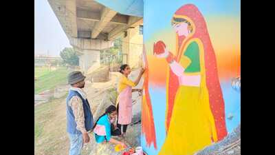 Artist Vinod Singh with two of his students, painting murals at the Lakshman Mela grounds for Chhath Puja on November 19 and 20. (HT photo) Artist Vinod Singh with two of his students, painting murals at the Lakshman Mela grounds for Chhath Puja on November 19 and 20. (HT photo)