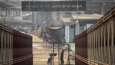 FILE- A Myanmarese looks towards the Indian side at the India-Myanmar border in Mizoram, India. (March 20, 2021) (AP) FILE- A Myanmarese looks towards the Indian side at the India-Myanmar border in Mizoram, India. (March 20, 2021) (AP)