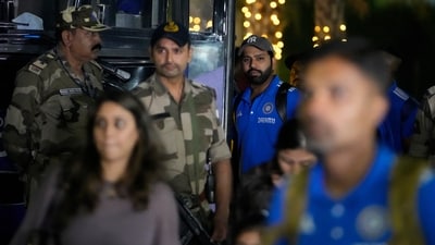India's captain Rohit Sharma, center looks on as the Indian team arrives at the airport to play the final match of ICC Men's Cricket World Cup in Ahmedabad (AP)