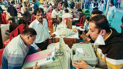 Polling officials at a distribution centre of EVMs and other election material ahead of Madhya Pradesh assembly elections, in Bhopal on Thursday. (PTI) Polling officials at a distribution centre of EVMs and other election material ahead of Madhya Pradesh assembly elections, in Bhopal on Thursday. (PTI)
