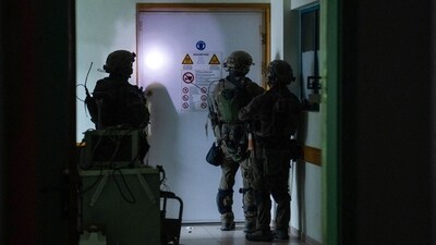 This handout picture released by the Israeli army on November 15, 2023, reportedly shows Israeli soldiers carrying out operations inside Al-Shifa hospital in Gaza City. (AFP) This handout picture released by the Israeli army on November 15, 2023, reportedly shows Israeli soldiers carrying out operations inside Al-Shifa hospital in Gaza City. (AFP)