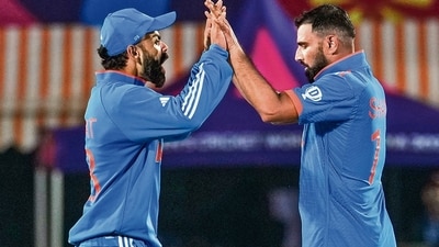 Virat Kohli and Mohammed Shami celebrate the wicket of New Zealand's Mitchell Santner during the ICC Men's World Cup ODI cricket match between India and New Zealand at the HPCA Stadium, Dharamshala on October 22, 2023. (Manvender Vashist Lav/PTI) Virat Kohli and Mohammed Shami celebrate the wicket of New Zealand's Mitchell Santner during the ICC Men's World Cup ODI cricket match between India and New Zealand at the HPCA Stadium, Dharamshala on October 22, 2023. (Manvender Vashist Lav/PTI)