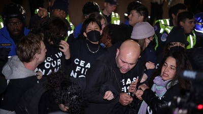 WASHINGTON, DC - NOVEMBER 15: Members of U.S. Capitol Police push protesters away from the headquarters of the Democratic National Committee during a demonstration against the war between Israel and Hamas on November 15, 2023 on Capitol Hill in Washington, DC. (Getty Images via AFP) WASHINGTON, DC - NOVEMBER 15: Members of U.S. Capitol Police push protesters away from the headquarters of the Democratic National Committee during a demonstration against the war between Israel and Hamas on November 15, 2023 on Capitol Hill in Washington, DC. (Getty Images via AFP)
