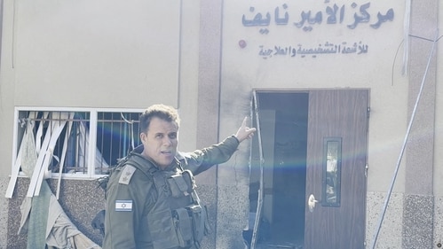 An Israeli officer points at hospital signage at the Al Shifa hospital complex in Gaza City on November 15, 2023. (Reuters)
