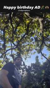 Aditya stood amidst greenery on a bright sunny day. Aditya stood amidst greenery on a bright sunny day.