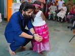 Naga Chaitanya with a child in Hyderabad.
