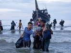 Ethnic Rohingya disembark from their boat upon landing in Ulee Madon, North Aceh, Indonesia, Thursday, Nov. 16, 2023. Ethnic Rohingya disembark from their boat upon landing in Ulee Madon, North Aceh, Indonesia, Thursday, Nov. 16, 2023.