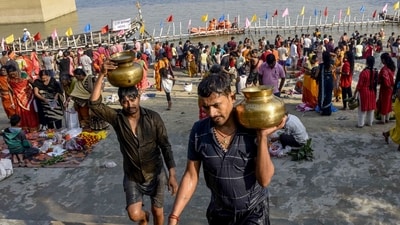 On the occasion of the Chhath festival in Patna on Friday, devotees reverently carry holy water from the Ganga river as part of the holy 'Nahaye Khaye' ritual. (ANI Photo) On the occasion of the Chhath festival in Patna on Friday, devotees reverently carry holy water from the Ganga river as part of the holy 'Nahaye Khaye' ritual. (ANI Photo)