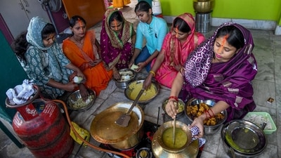 In Patna on Friday, devotees earnestly prepare prasad (offerings) during the 'Nahay Khay' ritual as part of the Chhath Puja festival. (ANI Photo) In Patna on Friday, devotees earnestly prepare prasad (offerings) during the 'Nahay Khay' ritual as part of the Chhath Puja festival. (ANI Photo)